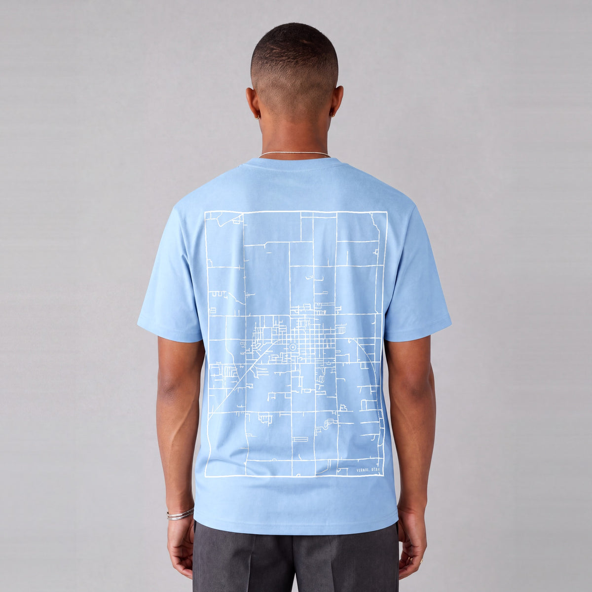 Vernal map tee, back print on model - Light Blue