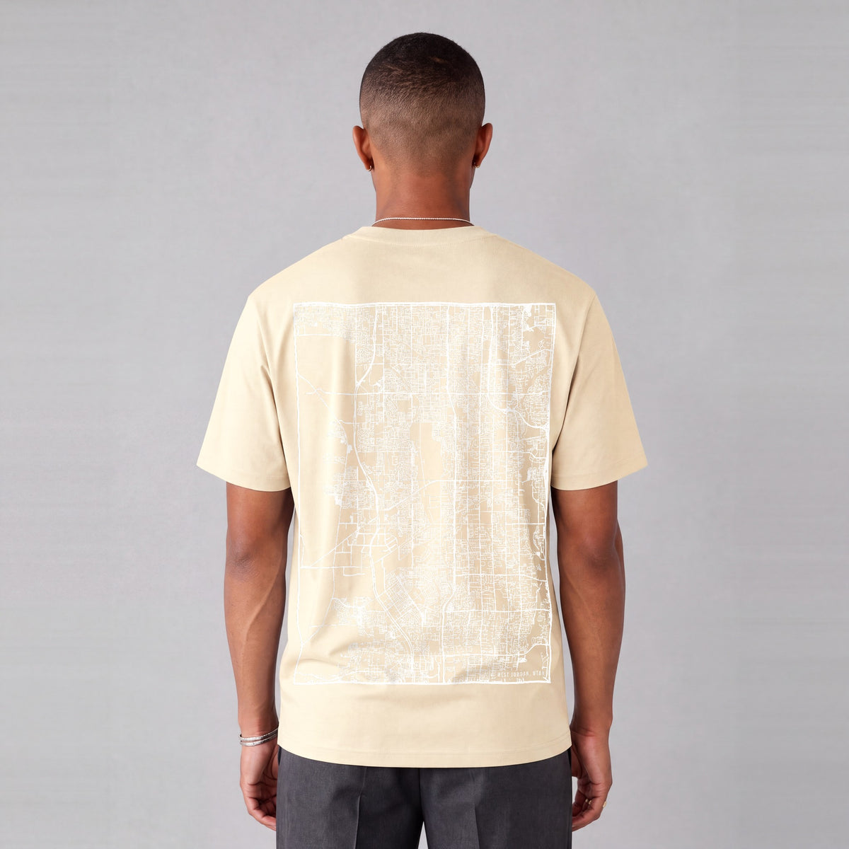 West Jordan map tee, back print on model - Cream