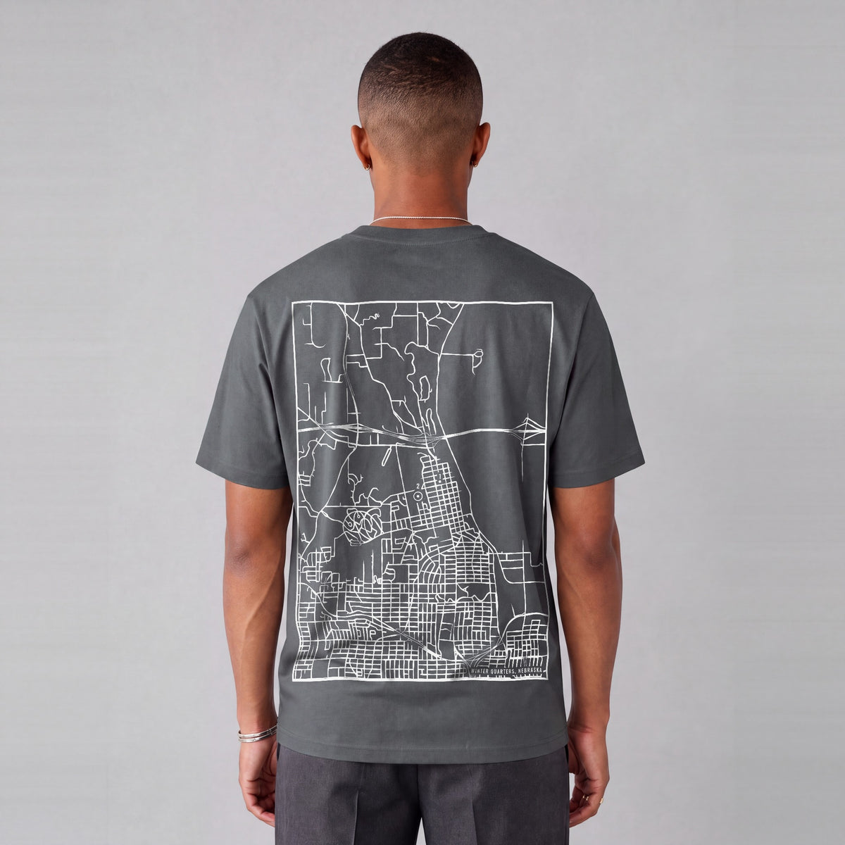Winter Quarters map tee, back print on model - Charcoal