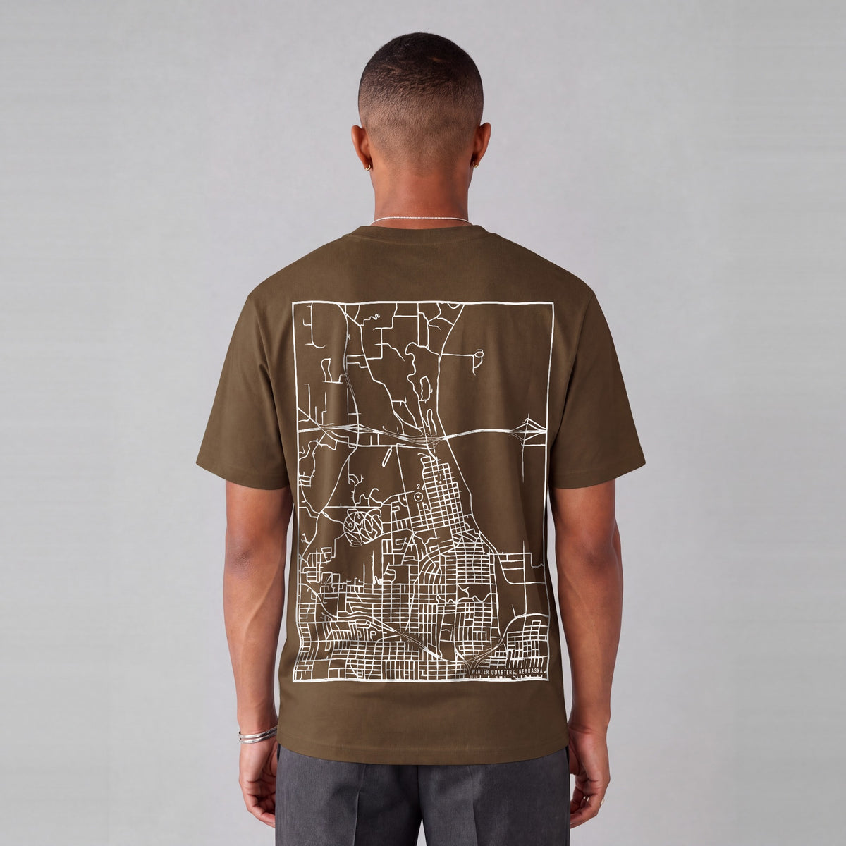 Winter Quarters map tee, back print on model - Coffee
