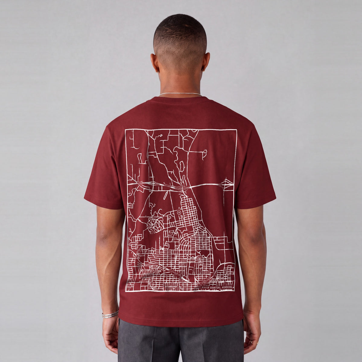 Winter Quarters map tee, back print on model - Maroon