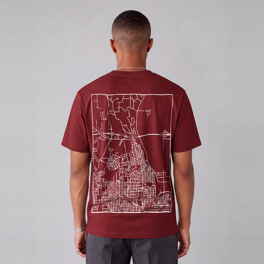 Winter Quarters map tee, back print on model - Maroon