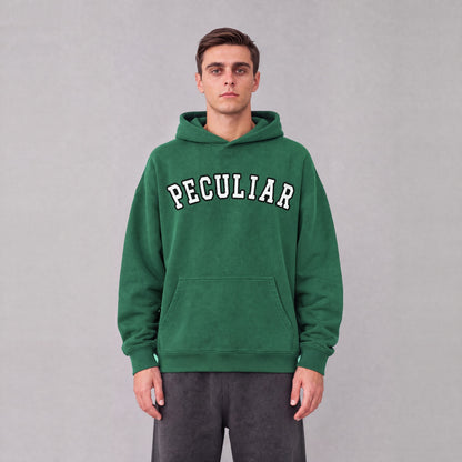 "Peculiar" collegiate hoodie front print on model - Eden Green