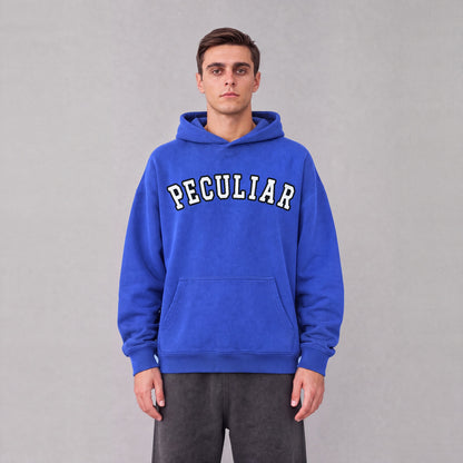 "Peculiar" collegiate hoodie front print on model - Royal Blue
