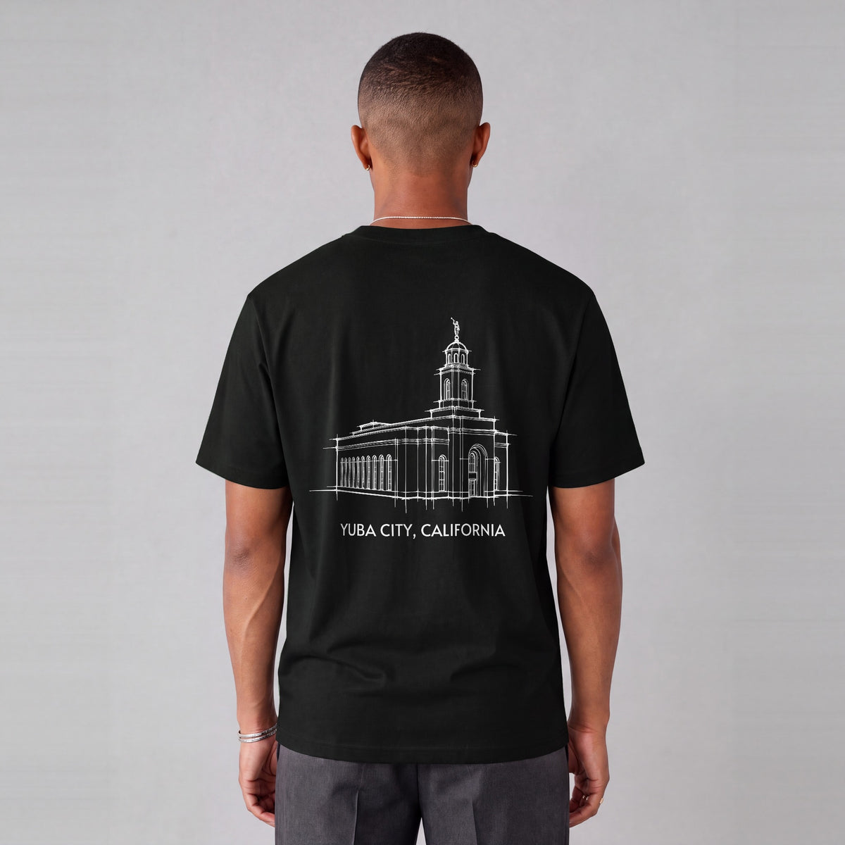 Feather River Temple back print on model - Black