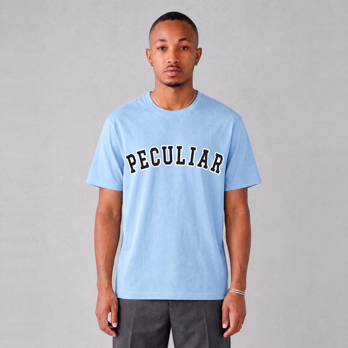 "Peculiar" collegiate tee front print on model - Light Blue