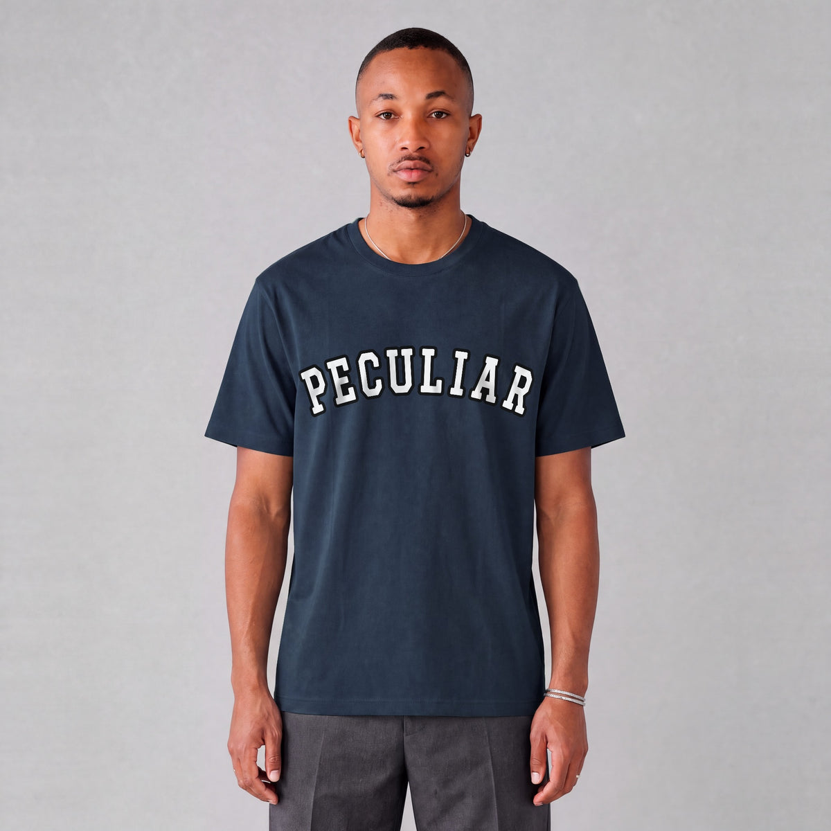 "Peculiar" collegiate tee front print on model - Navy Blue