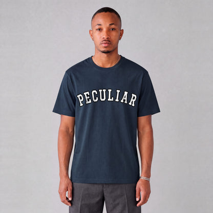 "Peculiar" collegiate tee front print on model - Navy Blue