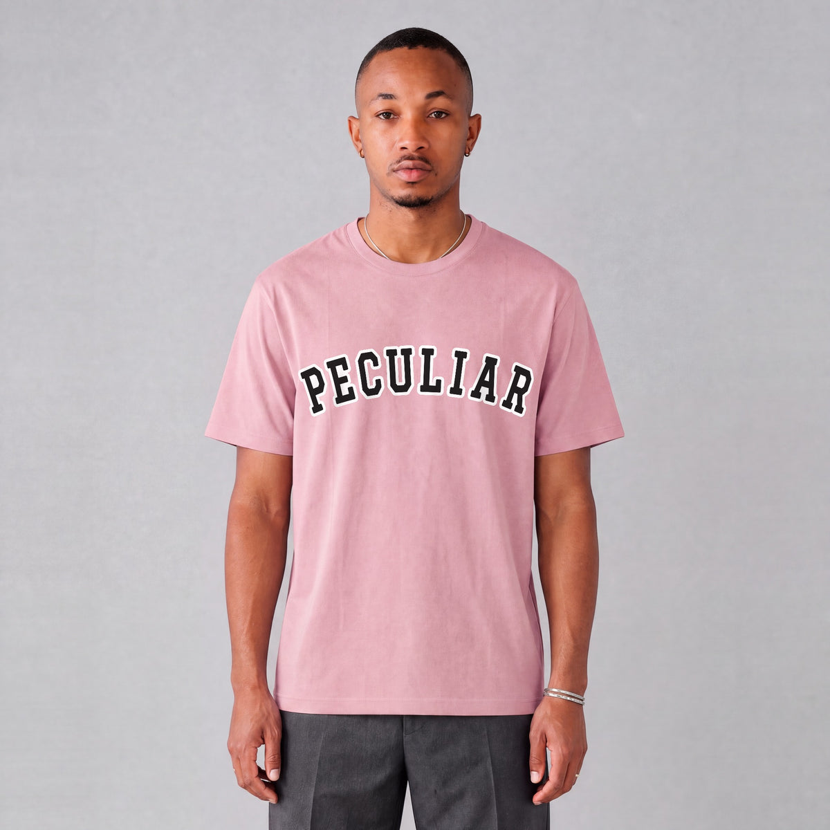 "Peculiar" collegiate tee front print on model - Pink