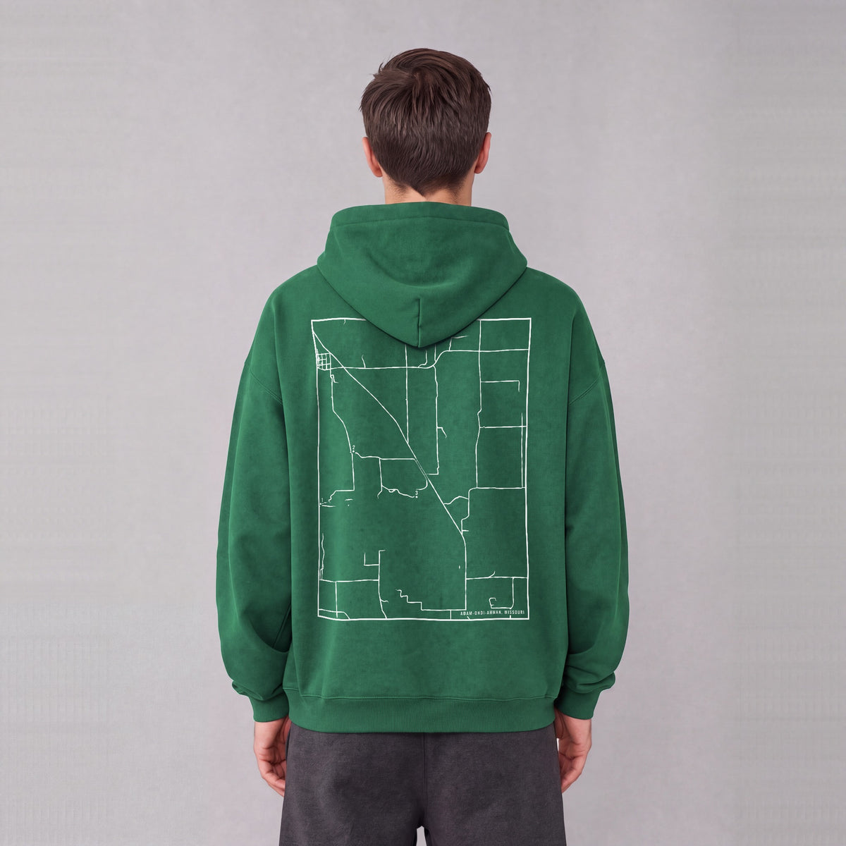 Adam-ondi-Ahman map hoodie, back print on model - Eden Green