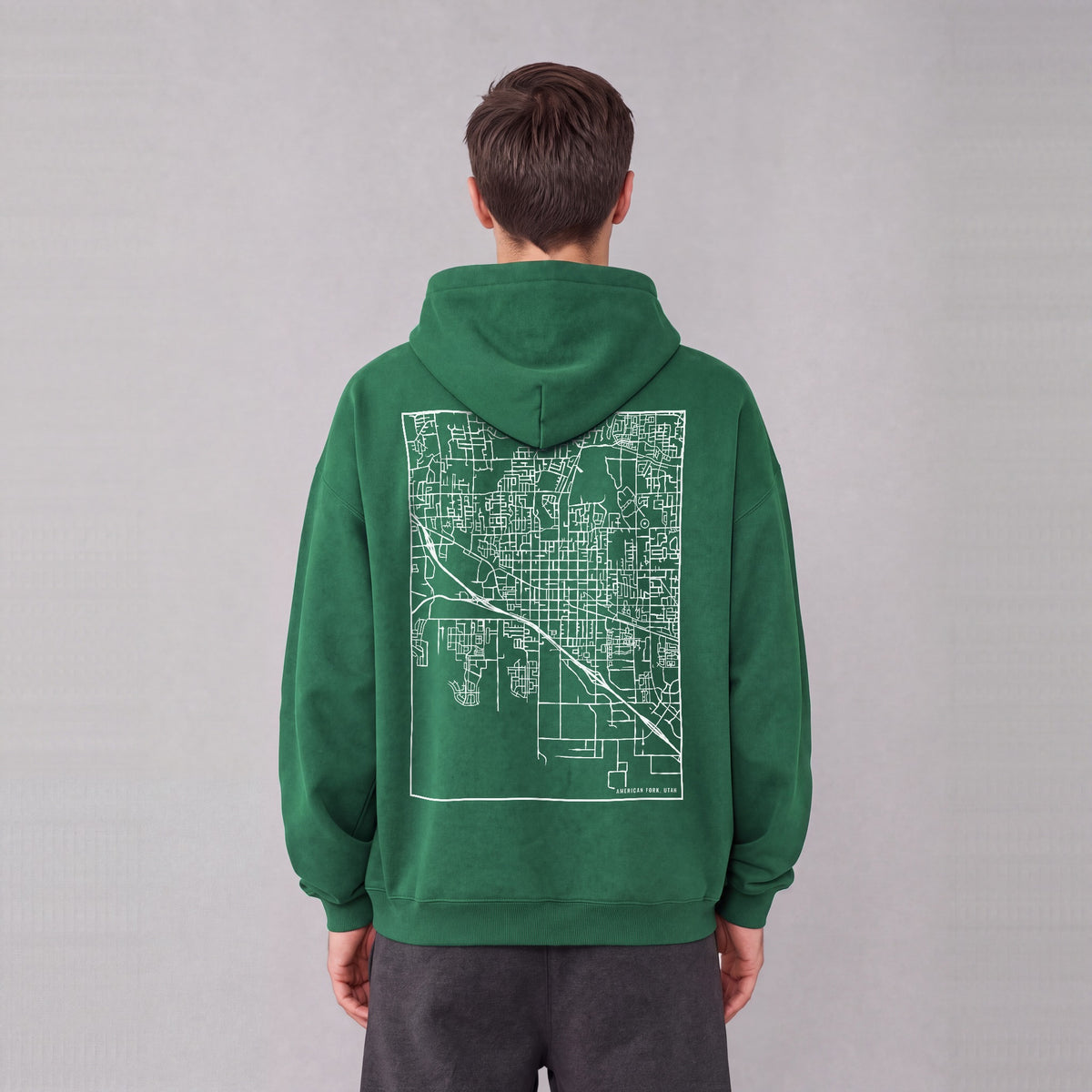 American Fork map hoodie, back print on model - Eden Green