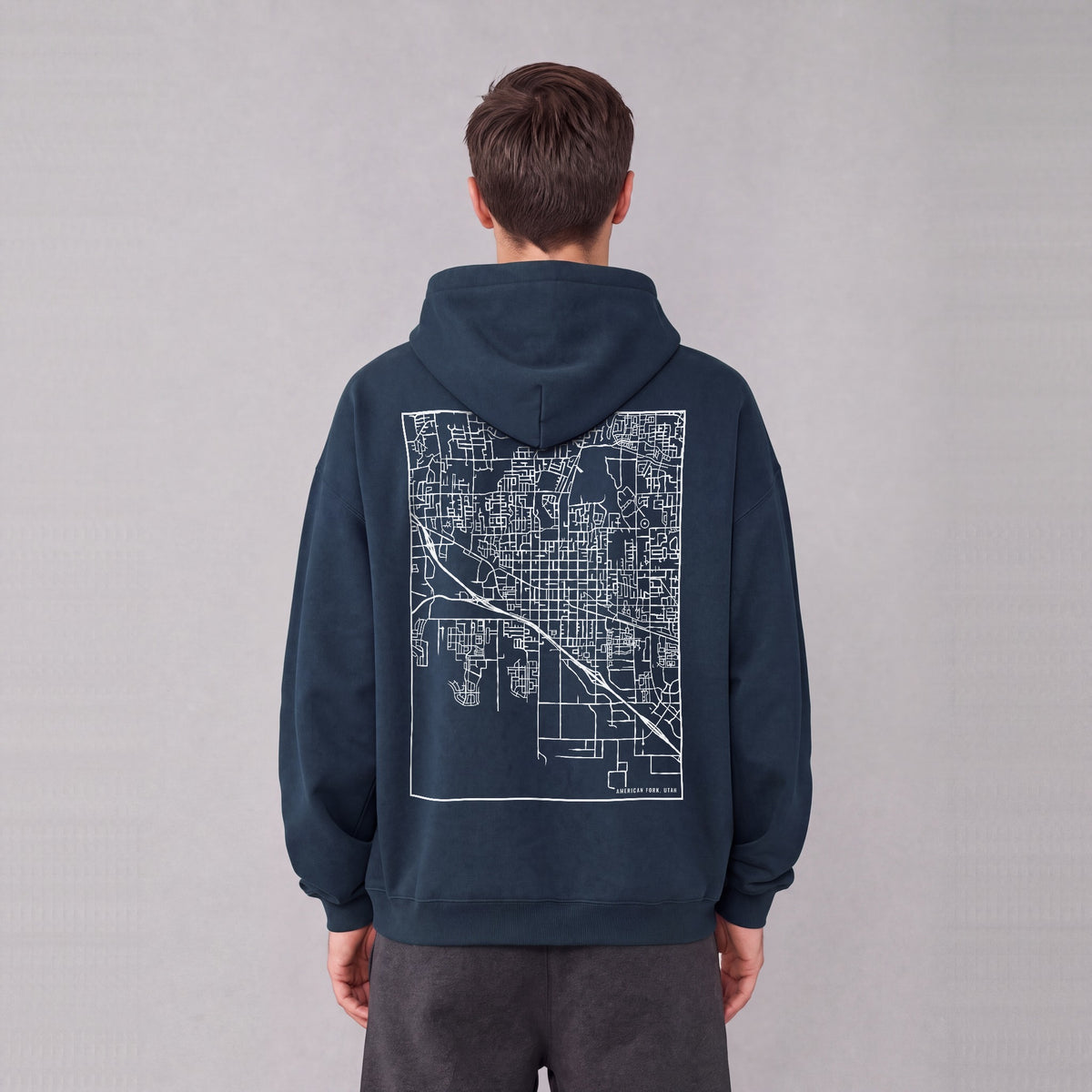American Fork map hoodie, back print on model - Navy Blue