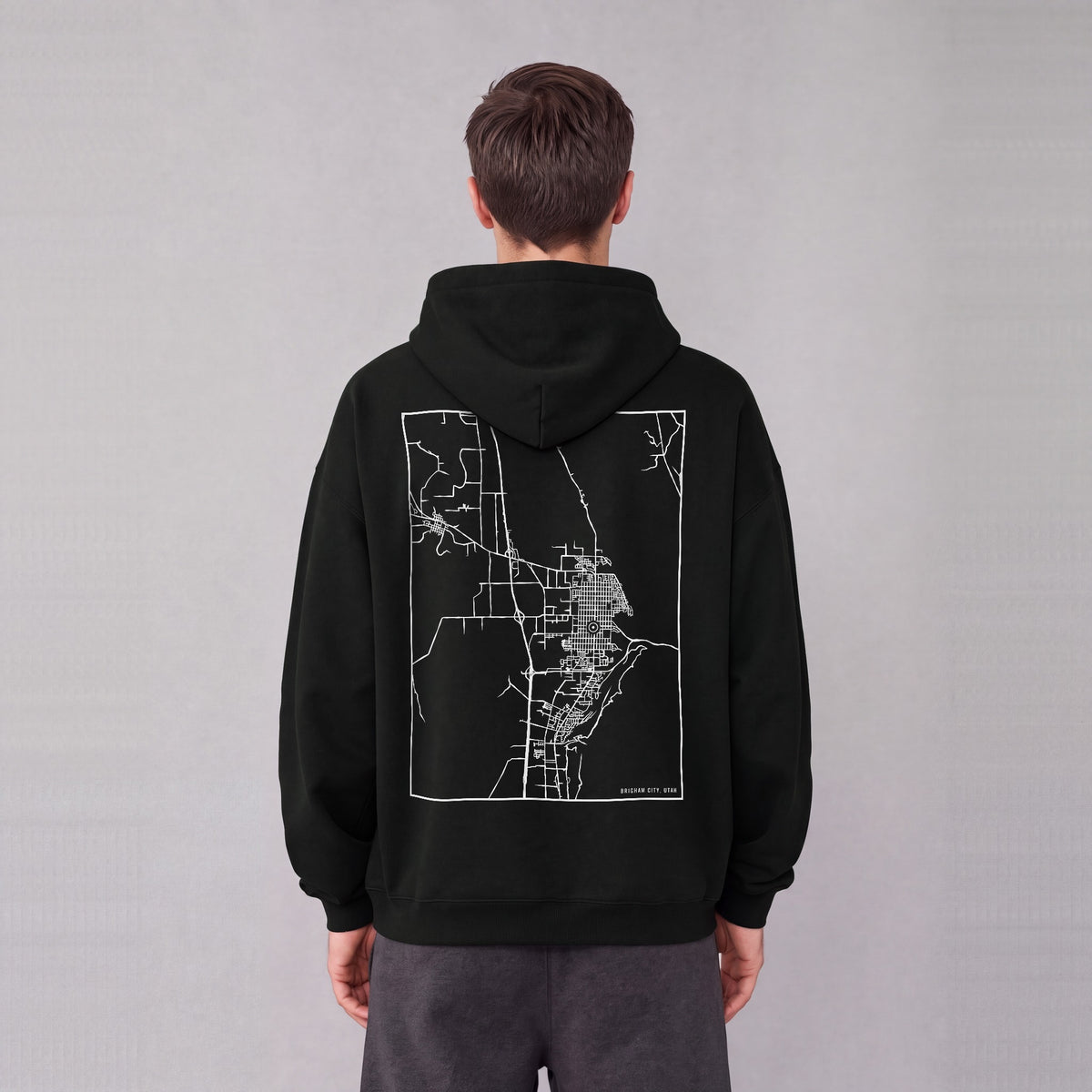 Brigham City map hoodie, back print on model - Black