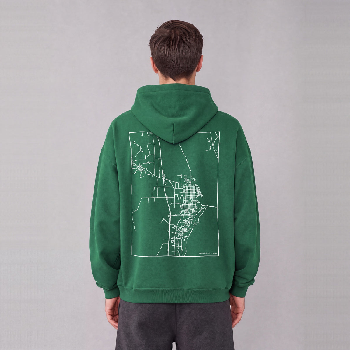 Brigham City map hoodie, back print on model - Eden Green