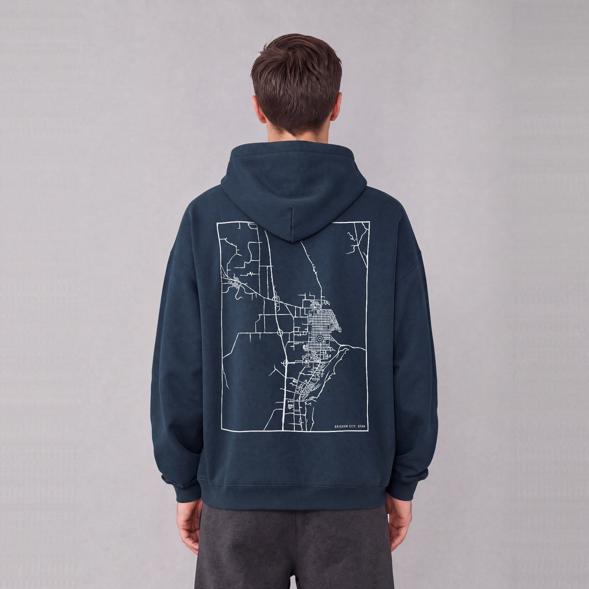 Brigham City map hoodie, back print on model - Navy Blue
