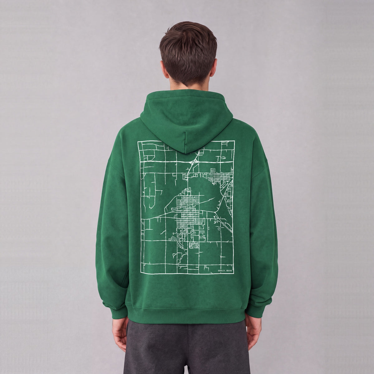 Burley map hoodie, back print on model - Eden Green