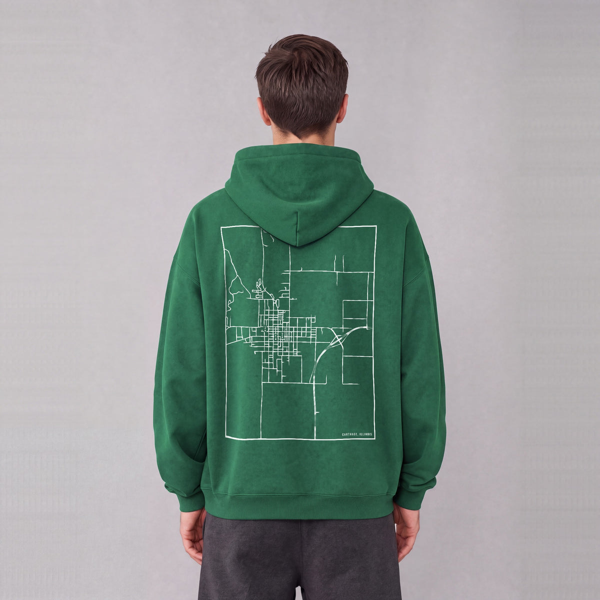 Carthage map hoodie, back print on model - Eden Green