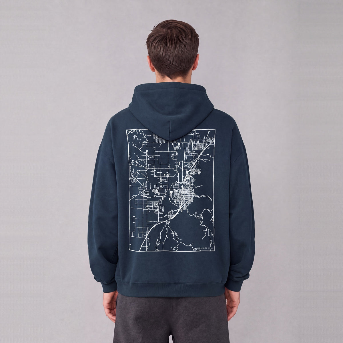 Cedar City map hoodie, back print on model - Navy Blue