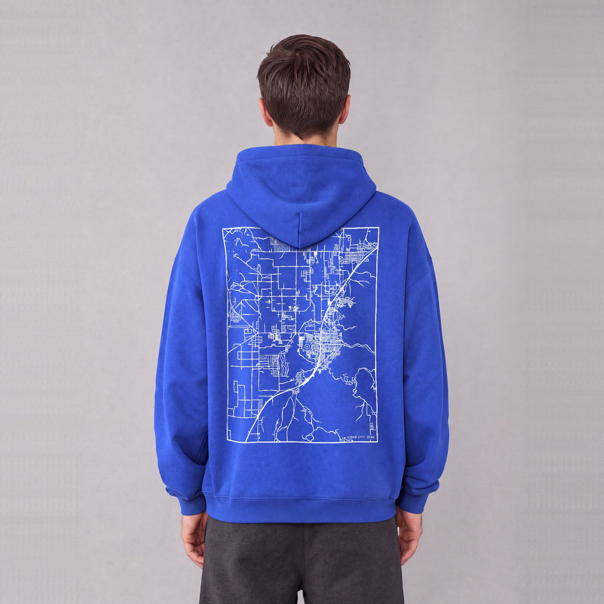 Cedar City map hoodie, back print on model - Royal Blue