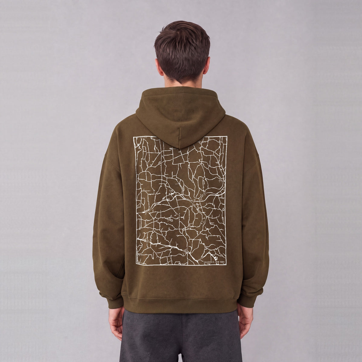 Colesville map hoodie, back print on model - Coffee