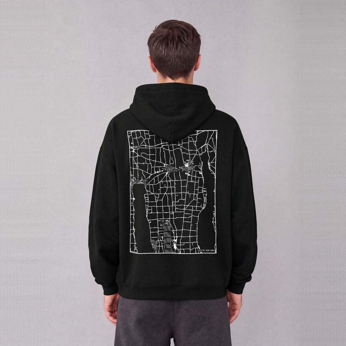 Fayette map hoodie, back print on model - Black