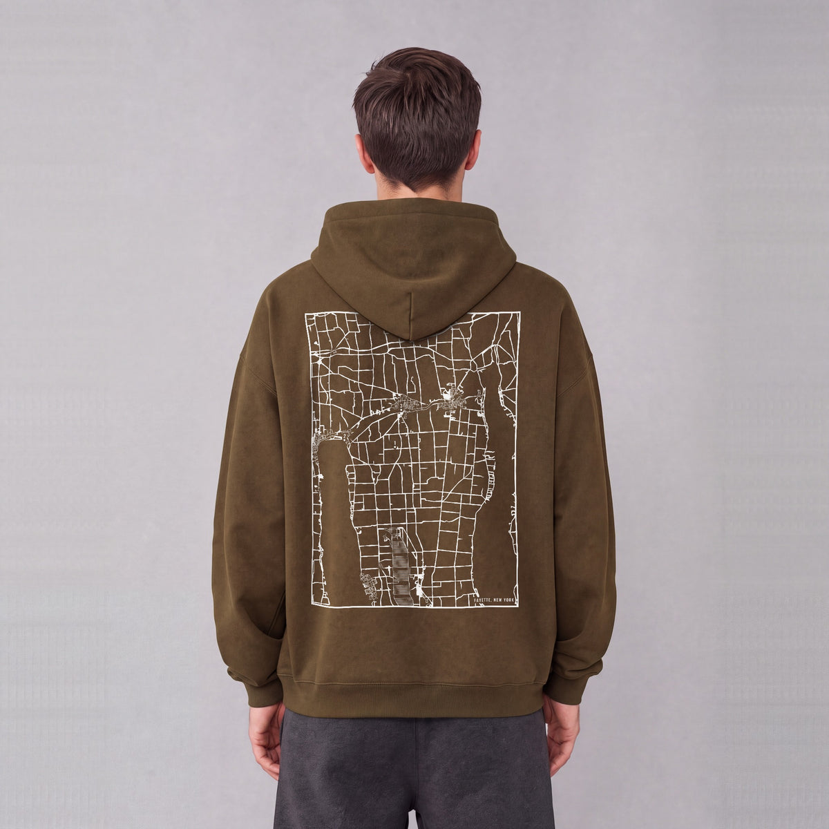 Fayette map hoodie, back print on model - Coffee