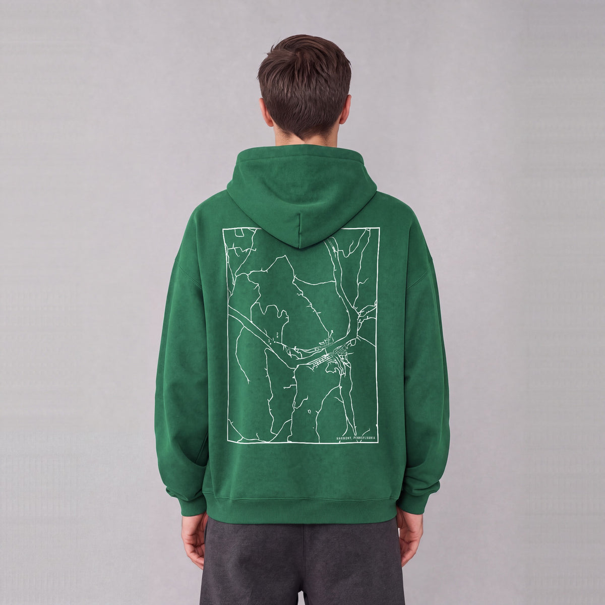 Harmony map hoodie, back print on model - Eden Green
