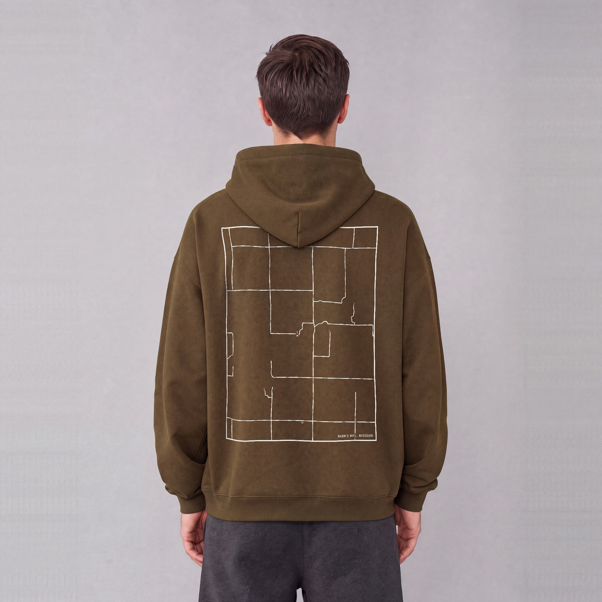Haun's Mill map hoodie, back print on model - Coffee
