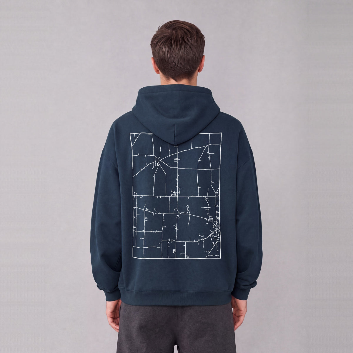 Hiram map hoodie, back print on model - Navy Blue