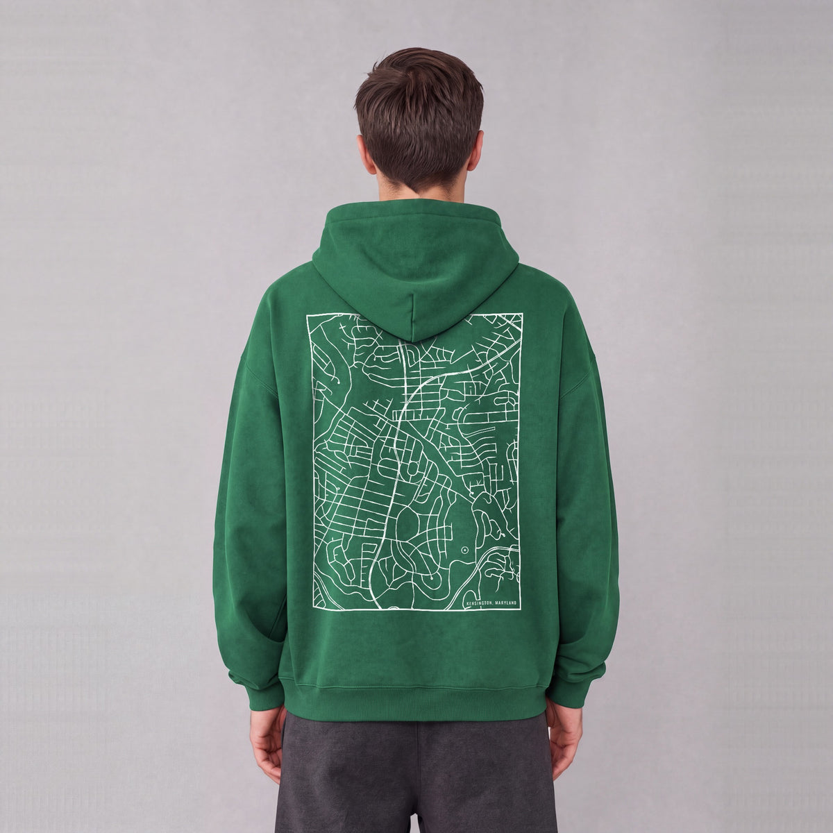 Kensington map hoodie, back print on model - Eden Green