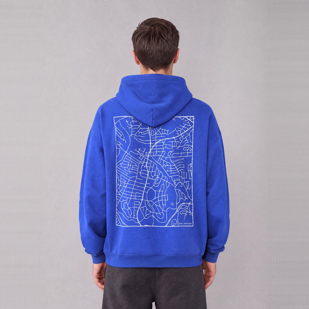 Kensington map hoodie, back print on model - Royal Blue