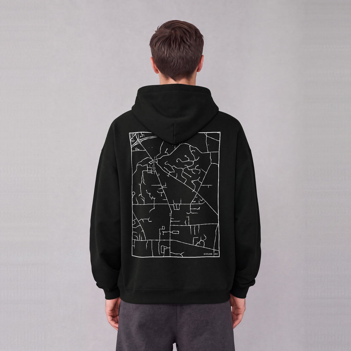 Kirtland map hoodie, back print on model - Black