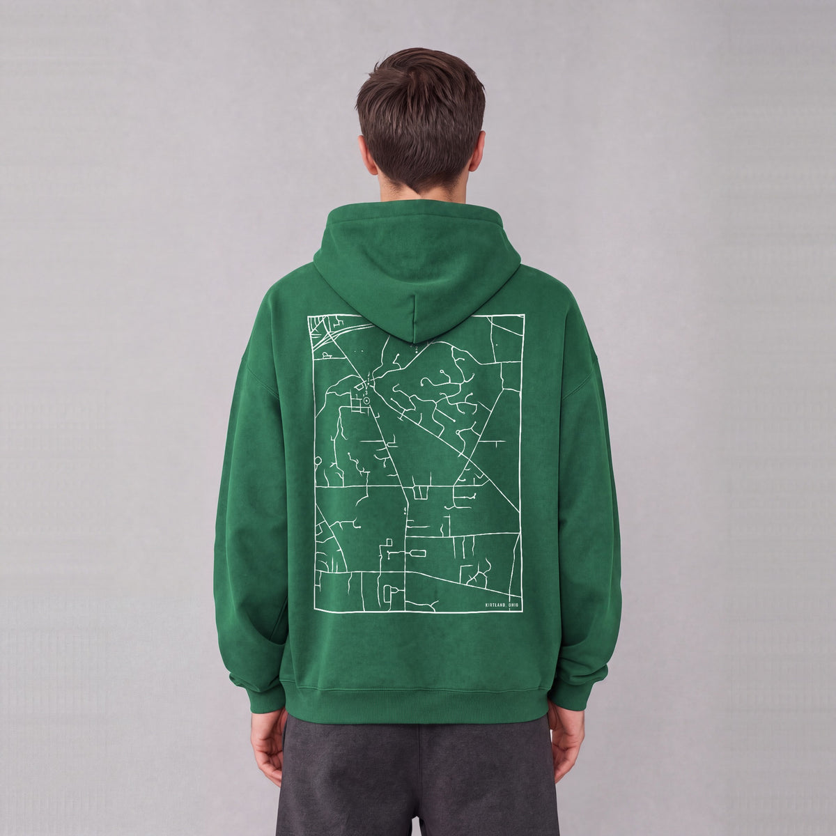 Kirtland map hoodie, back print on model - Eden Green