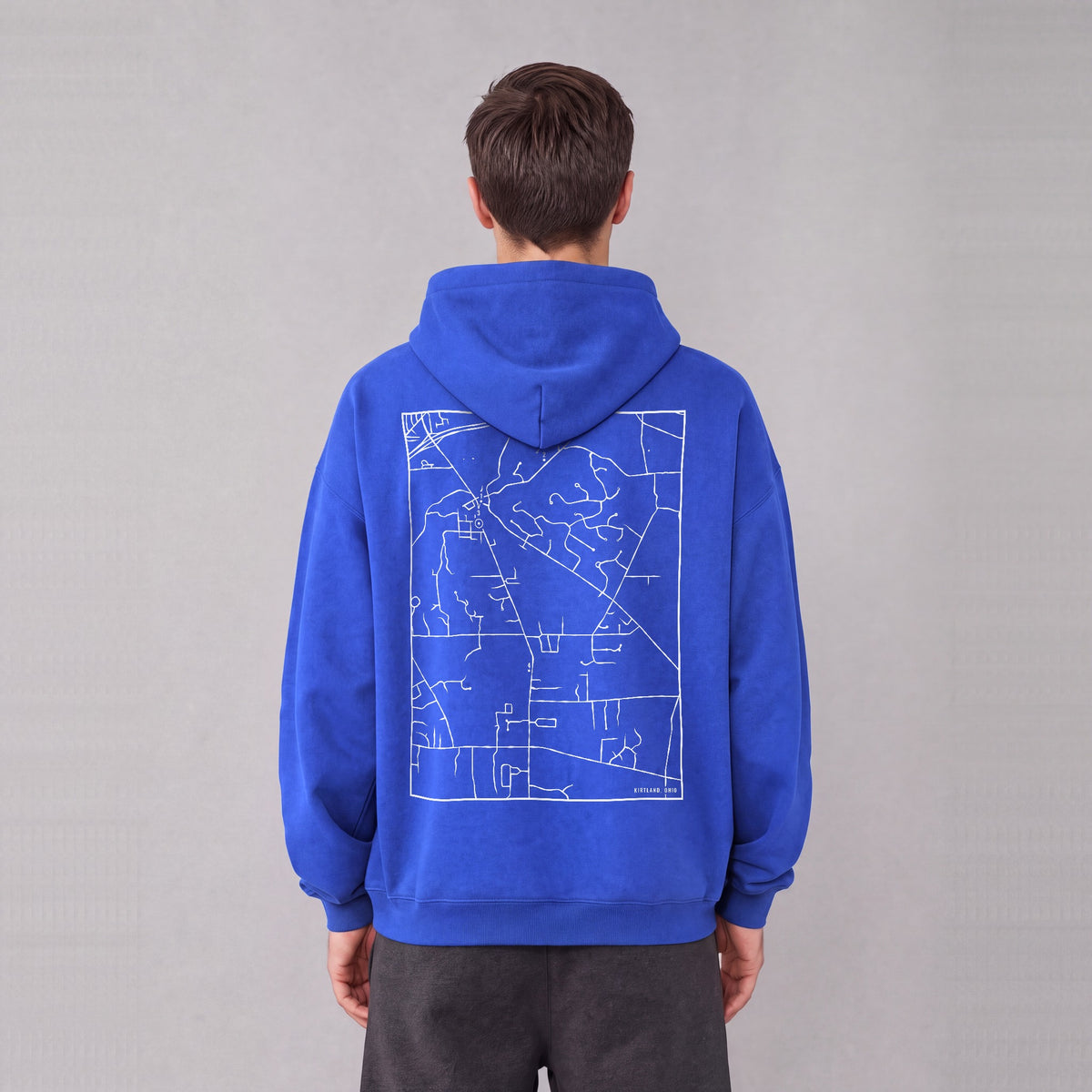 Kirtland map hoodie, back print on model - Royal Blue