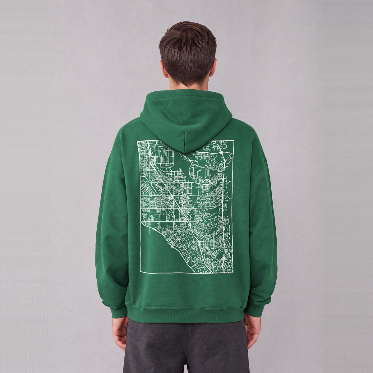 Layton map hoodie, back print on model - Eden Green