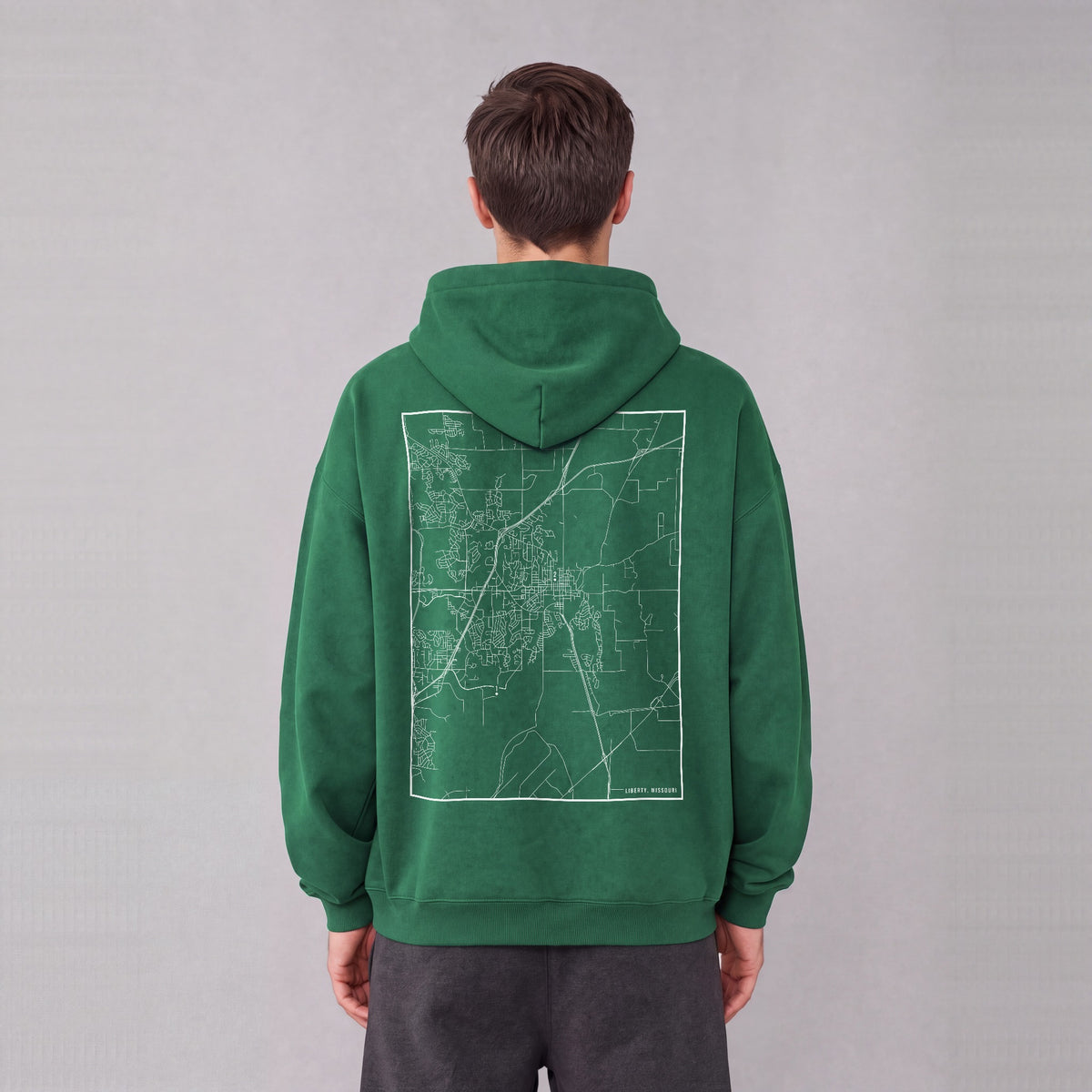 Liberty map hoodie, back print on model - Eden Green
