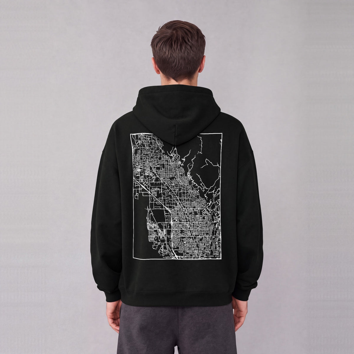 Lindon map hoodie, back print on model - Black