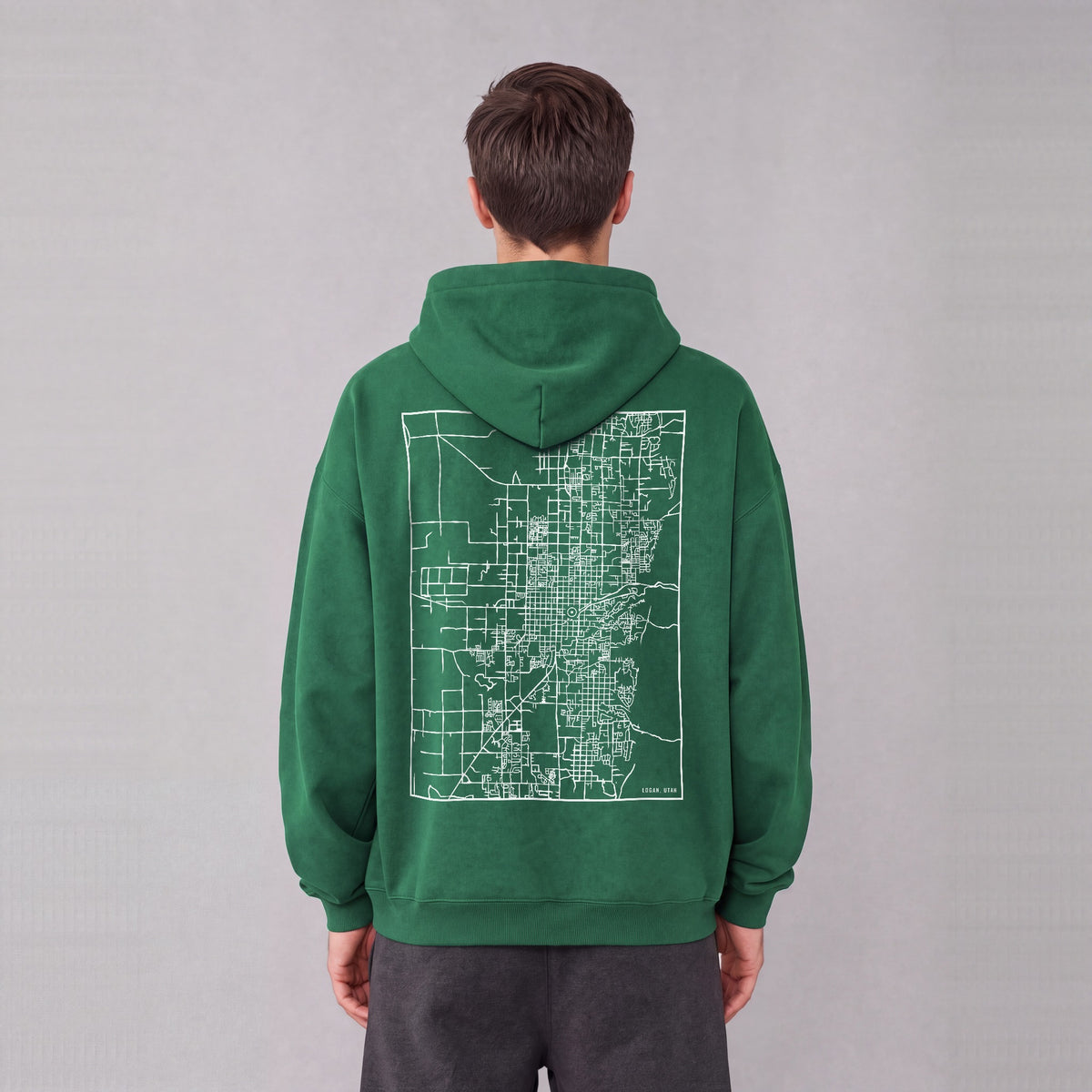 Logan map hoodie, back print on model - Eden Green