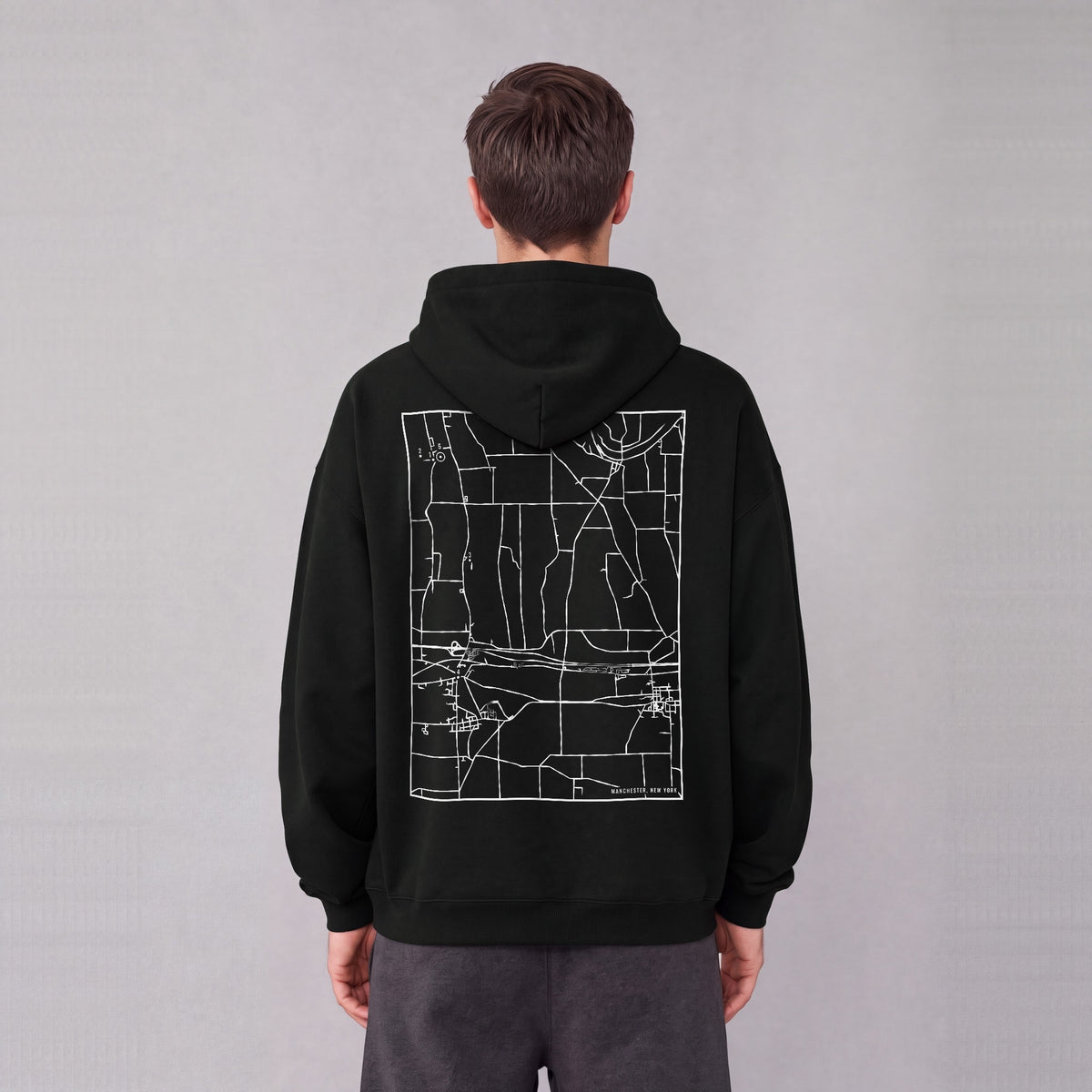 Manchester map hoodie, back print on model - Black