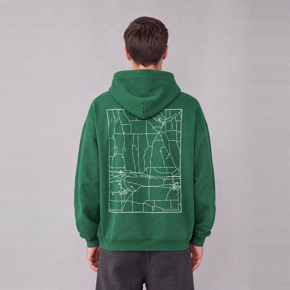 Manchester map hoodie, back print on model - Eden Green