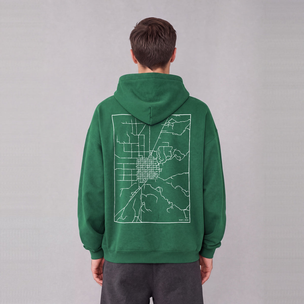 Manti map hoodie, back print on model - Eden Green