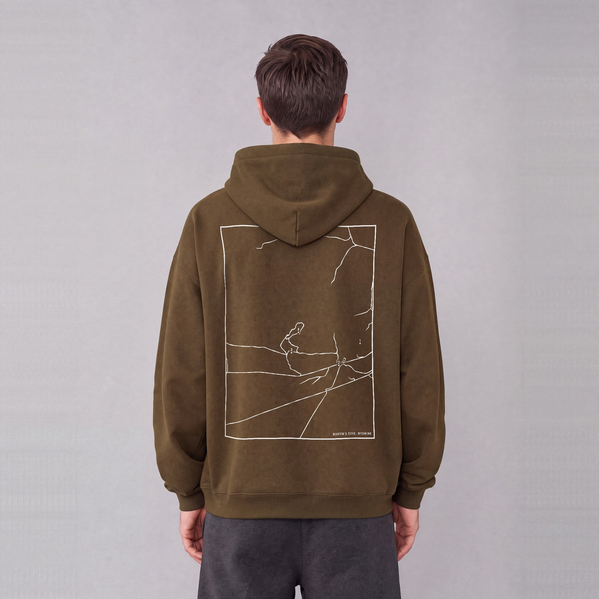 Martin's Cove map hoodie, back print on model - Coffee
