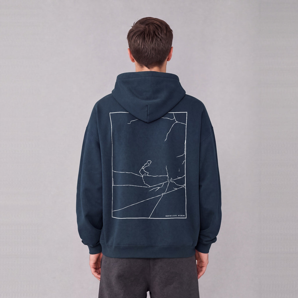 Martin's Cove map hoodie, back print on model - Navy Blue