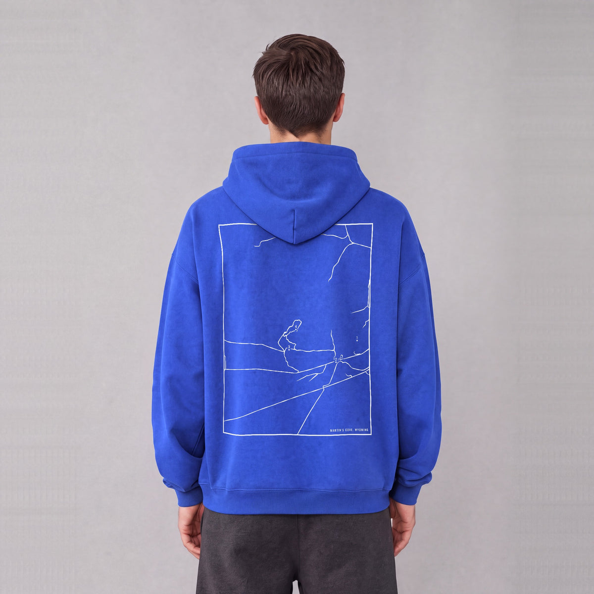 Martin's Cove map hoodie, back print on model - Royal Blue