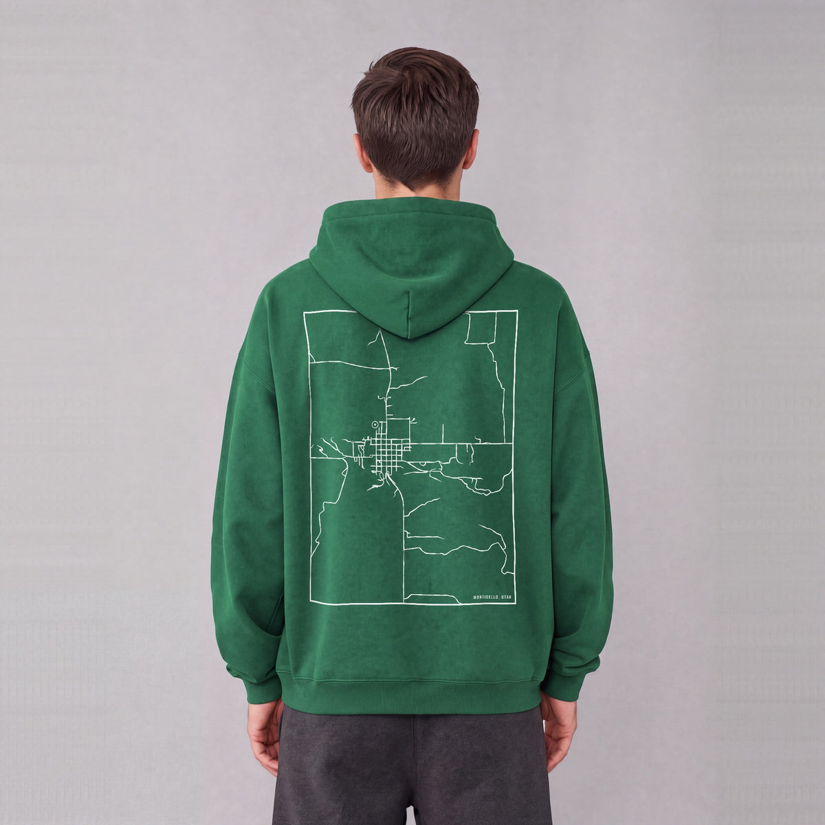 Monticello map hoodie, back print on model - Eden Green