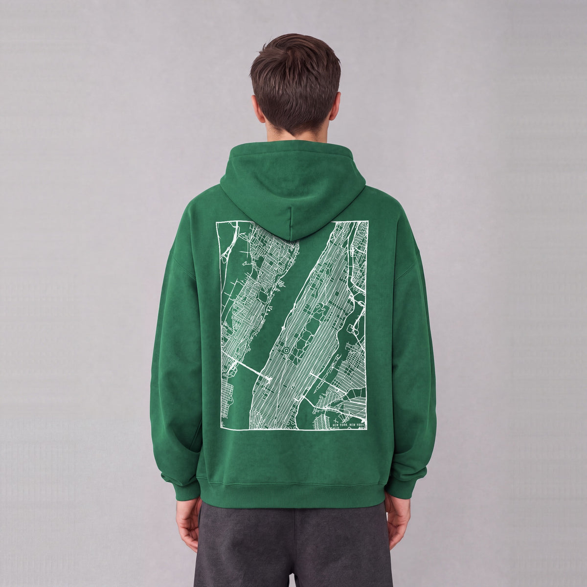 New York map hoodie, back print on model - Eden Green