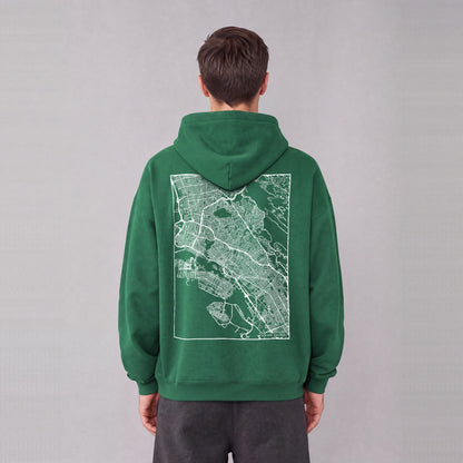 Oakland map hoodie, back print on model - Eden Green