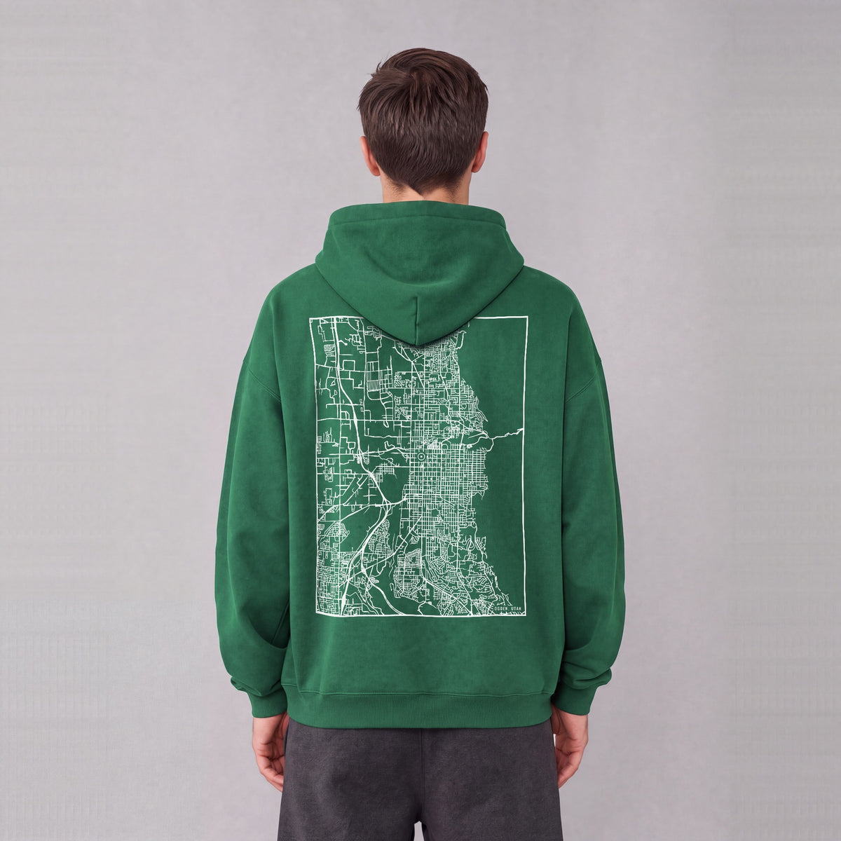Ogden map hoodie, back print on model - Eden Green