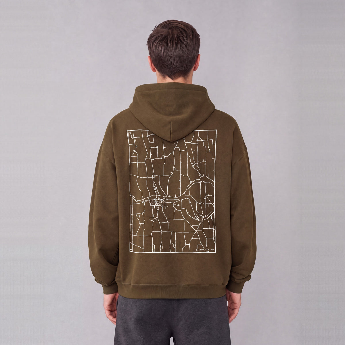 Palmyra map hoodie, back print on model - Coffee