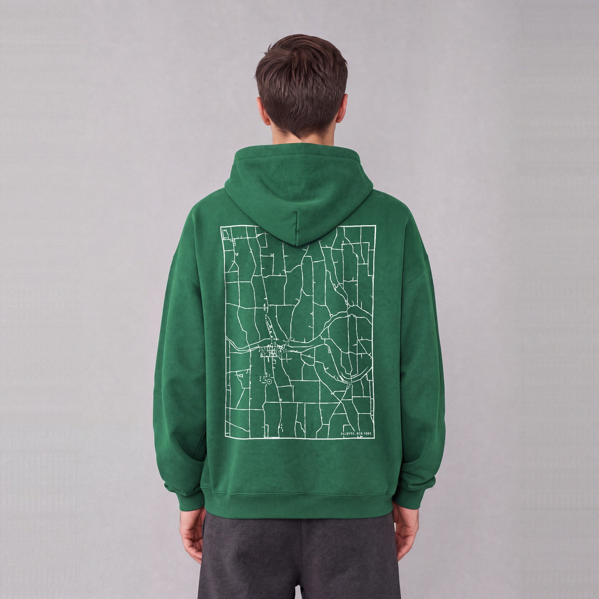 Palmyra map hoodie, back print on model - Eden Green
